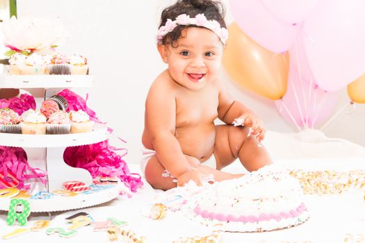 Young Baby Girl Celebrating Her First Birthday With Cake