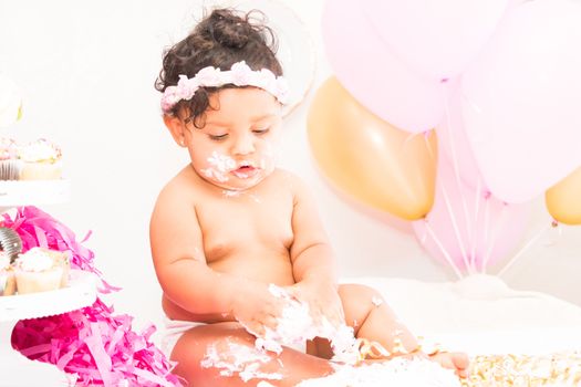 Young Baby Girl Celebrating Her First Birthday With Cake