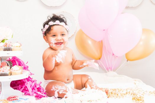 Young Baby Girl Celebrating Her First Birthday With Cake