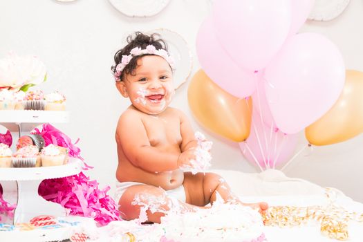 Young Baby Girl Celebrating Her First Birthday With Cake