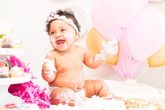 Young Baby Girl Celebrating Her First Birthday With Cake