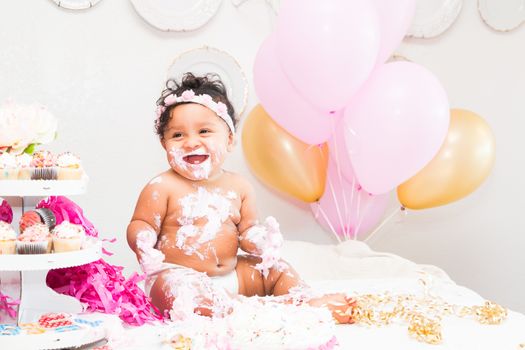 Young Baby Girl Celebrating Her First Birthday With Cake