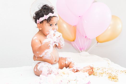 Young Baby Girl Celebrating Her First Birthday With Cake