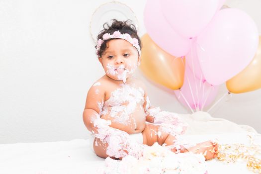 Young Baby Girl Celebrating Her First Birthday With Cake