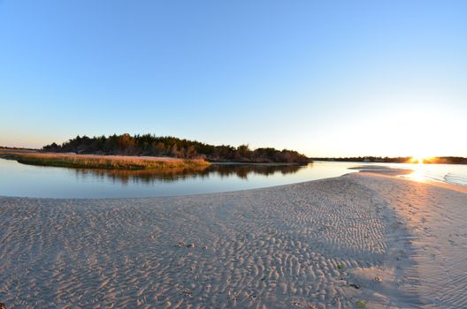 A view of the shore around the north end of Carolina Beach at sunset