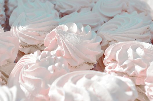 Many white aerial cakes, meringue and marshmallows