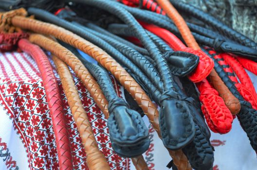 Multi-colored leather whip for horses at the fair