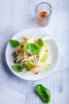 Fresh Fennel and apple salad on a white plate