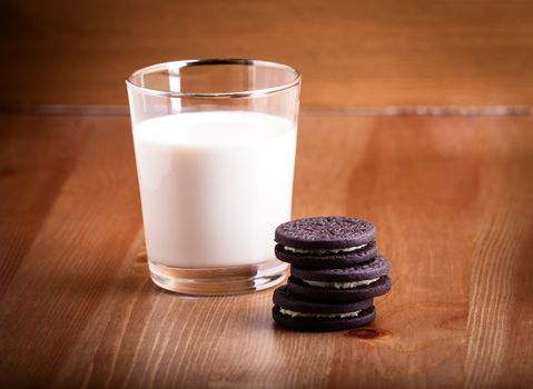 Milk and cookies served on a table
