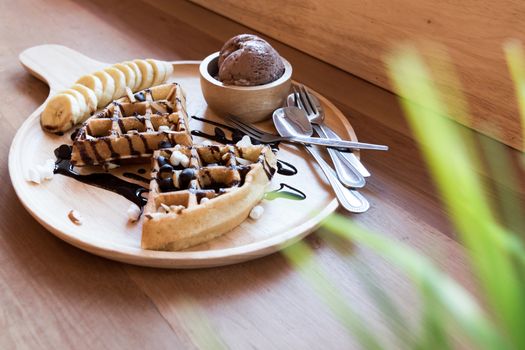 Belgian waffles with strawberry, cherry, blueberry, and chocolate sauce