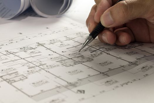 Workplace of architect - Architect rolls and plans.architectural plan,technical project drawing. Engineering tools view from the top. Construction background.
