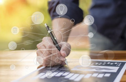 businessman hand working with new modern computer and business strategy as concept.