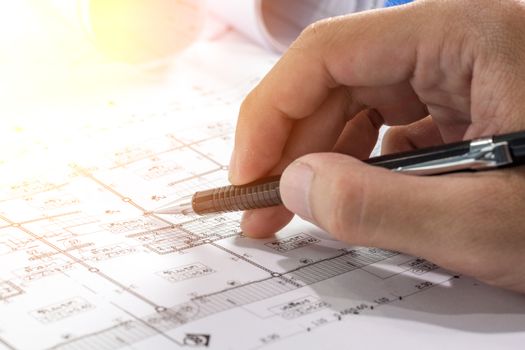 Workplace of architect - Architect rolls and plans.architectural plan,technical project drawing. Engineering tools view from the top. Construction background.