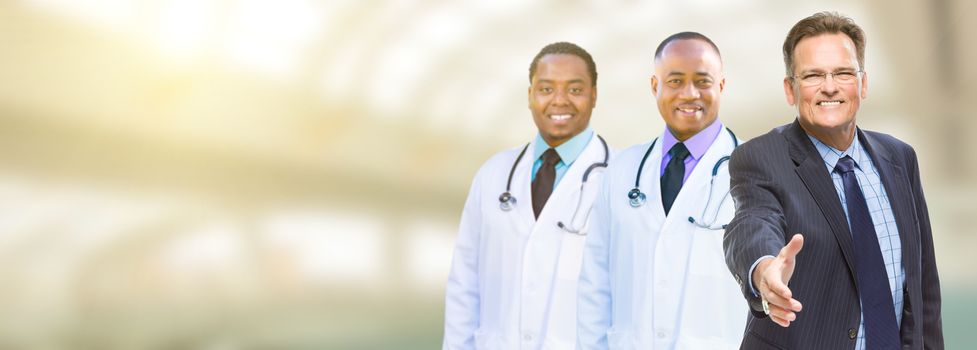 Caucasian Businessman and African American Male Doctors, Nurses or Pharmacists with Room For Text.