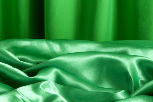 a elegant background with a green fabric