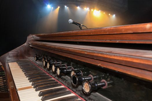 Old keys music instrument at a concert with focus on the foreground, background out of focus.