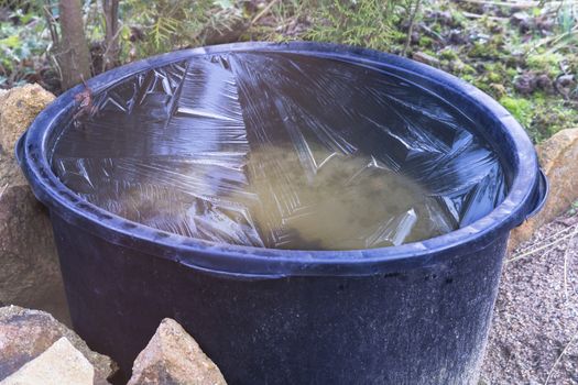 Frozen water in a old Mortar bucket.