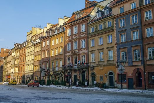 Warsaw, Poland -January 5, 2011: Houses in old town market square, Warsaw, Poland. Winter time with snow