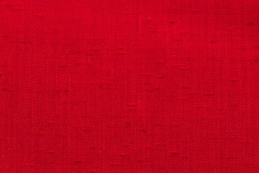 Rustic canvas fabric texture in red color.