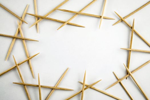 abstract border of toothpicks on white background
