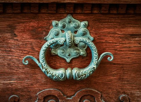 Ornate Brass Door Knocker On A Vintage Wooden Door