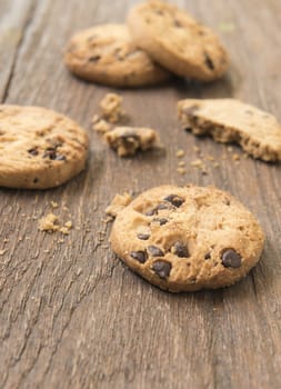 Cookies chocolate or chocolate chips on a wooden table.