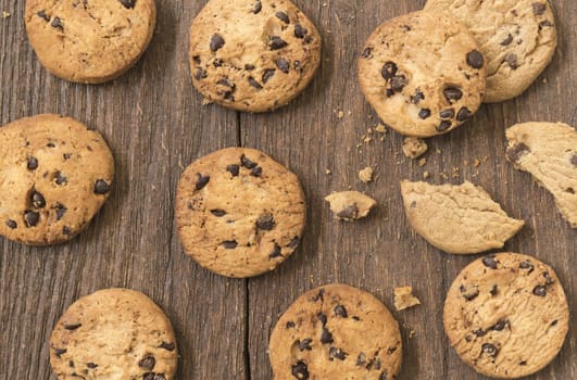 Cookies chocolate or chocolate chips on a wooden table.