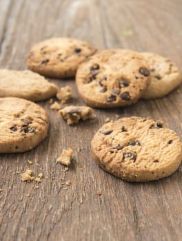 Cookies chocolate or chocolate chips on a wooden table.