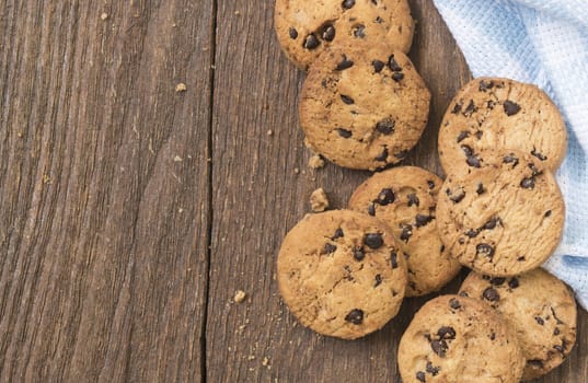 Cookies chocolate or chocolate chips on a wooden table.