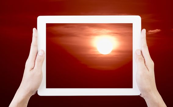 Use your tablet to take pictures before sunset on a beautiful evening.