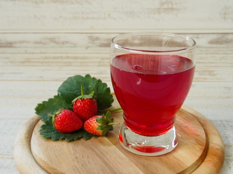 Strawberry Juice In the white wood background