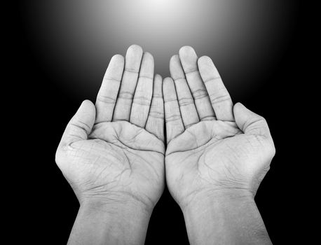 Black and white human hands of prayer