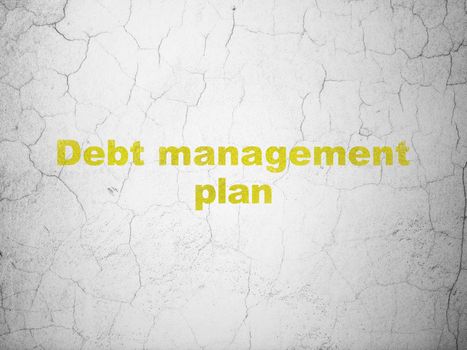 Finance concept: Yellow Debt Management Plan on textured concrete wall background