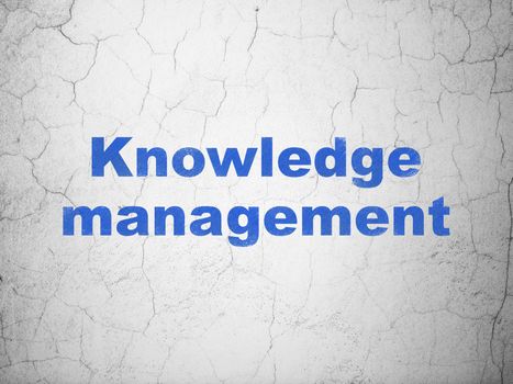 Learning concept: Blue Knowledge Management on textured concrete wall background