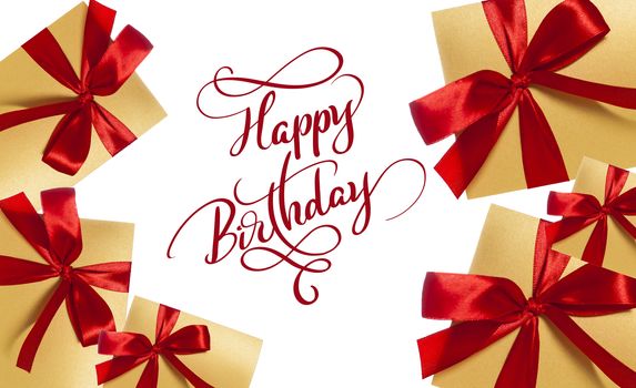 background for greeting card boxes with red bow and text Happy Birthday. Calligraphy lettering.