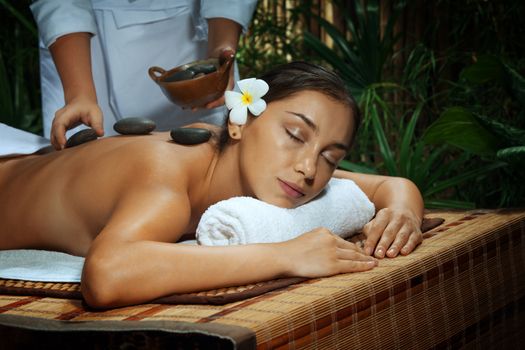 portrait of young beautiful woman in spa environment