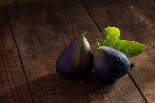 close up view of fresh figs on color back