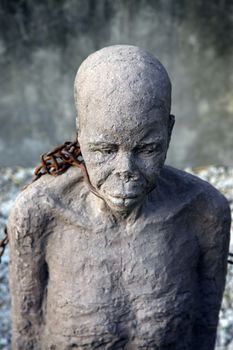 A statue in Stone Town. Zanzibar dipicting and mourning the African slave trade