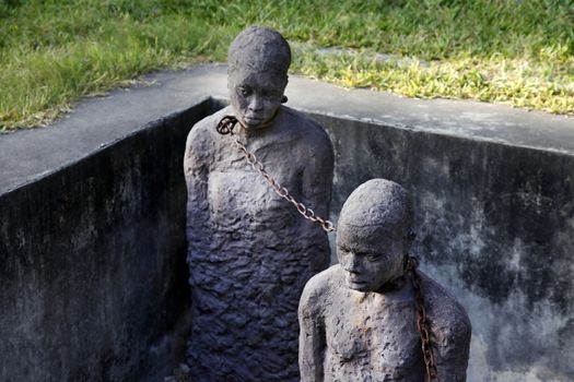 A statue in Stone Town. Zanzibar dipicting and mourning the African slave trade
