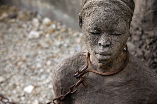 A statue in Stone Town. Zanzibar dipicting and mourning the African slave trade