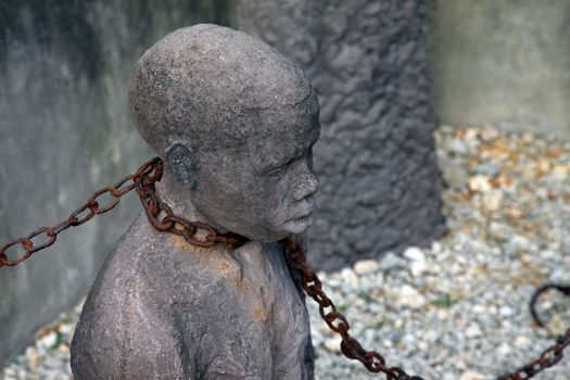A statue in Stone Town. Zanzibar dipicting and mourning the African slave trade