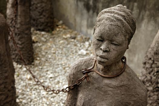 A statue in Stone Town. Zanzibar dipicting and mourning the African slave trade
