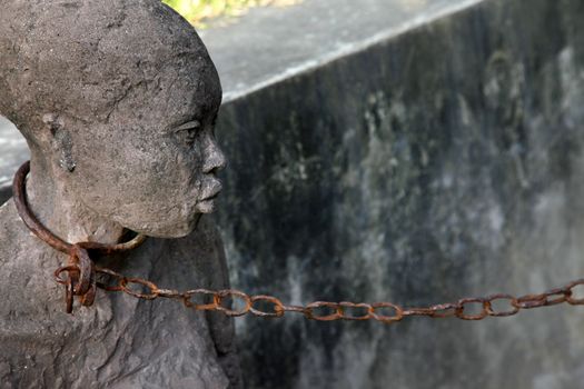 A statue in Stone Town. Zanzibar dipicting and mourning the African slave trade
