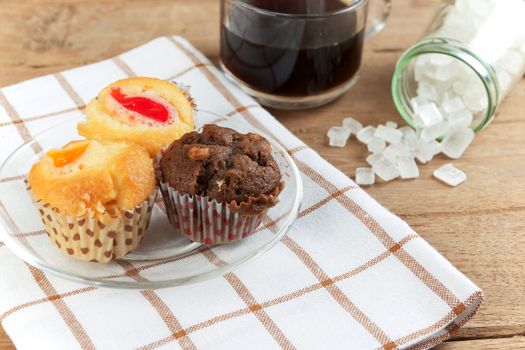 Cupcake various flavors in wood tray on wood table. coffee break