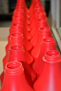 Red plastic bottles. Photo of red plastic bottles