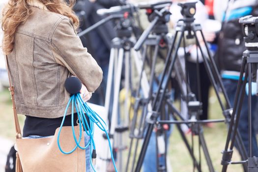 Female journalist waiting for press conference