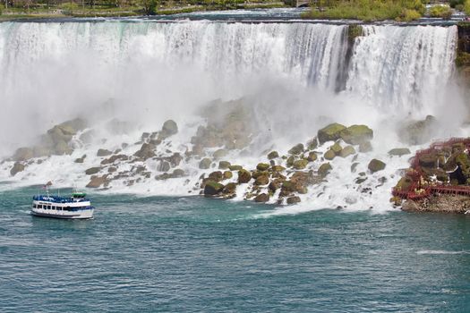 Beautiful photo of a ship near amazing Niagara waterfall