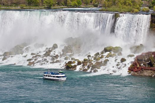 Beautiful photo of a ship near amazing Niagara waterfall