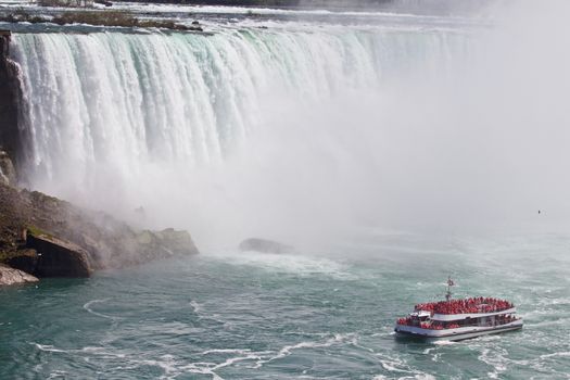 Beautiful photo of a ship near amazing Niagara waterfall