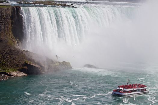 Beautiful photo of a ship near amazing Niagara waterfall